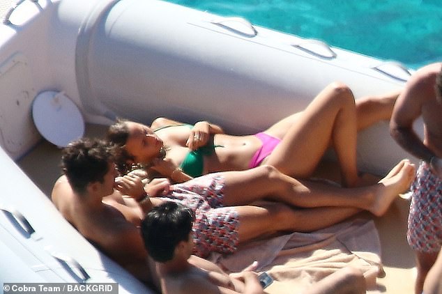 Love boat: The breakthrough driver was seen cuddling up with his girlfriend on a boat trip in the Mediterranean