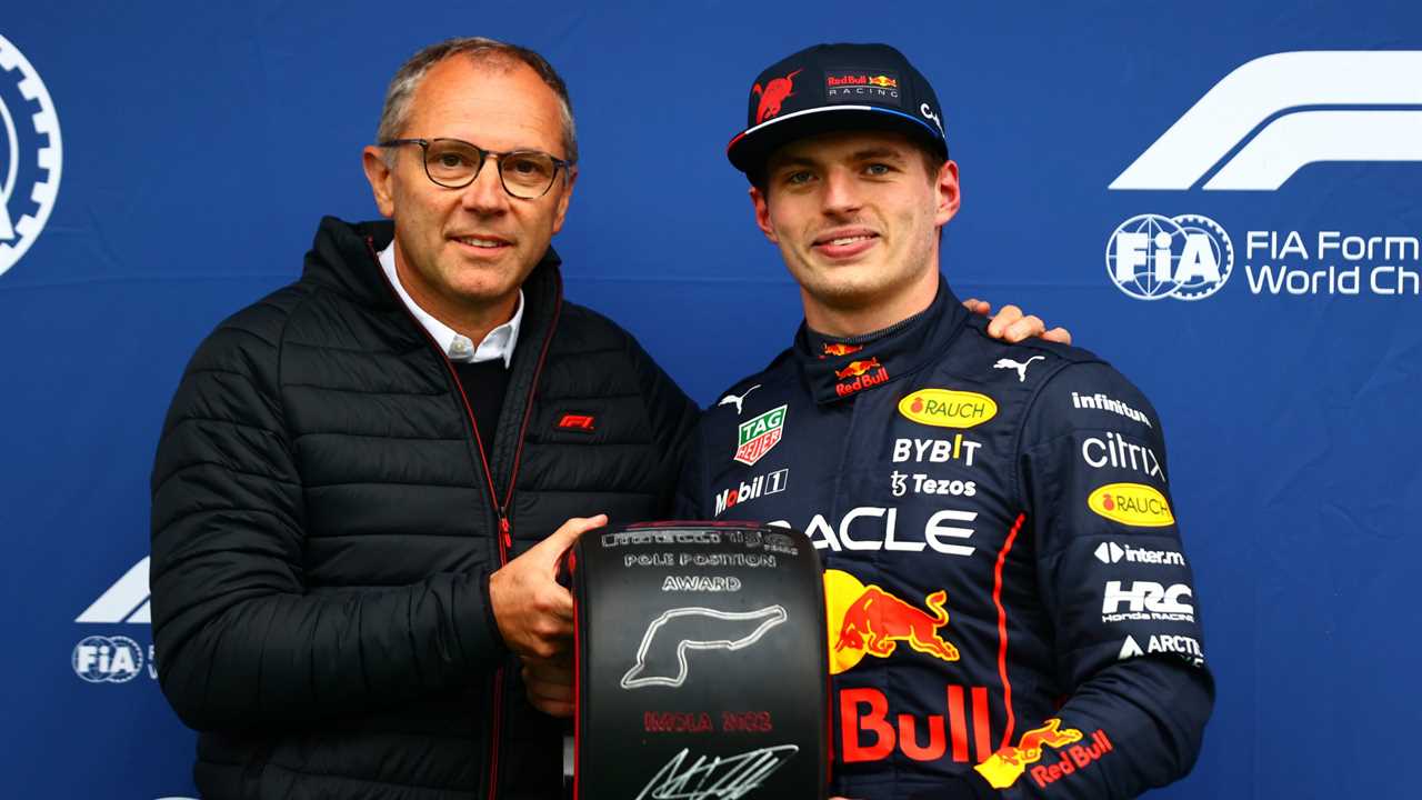 IMOLA, ITALY - APRIL 22: Pole position qualifier Max Verstappen of the Netherlands and Oracle Red Bull Racing collects his Pole Position award from Stefano Domenicali, CEO of the Formula One Group, in parc ferme during qualifying ahead of the F1 Grand Prix of Emilia Romagna at Autodromo Enzo e Dino Ferrari on April 22, 2022 in Imola, Italy. (Photo by Dan Istitene - Formula 1/Formula 1 via Getty Images)