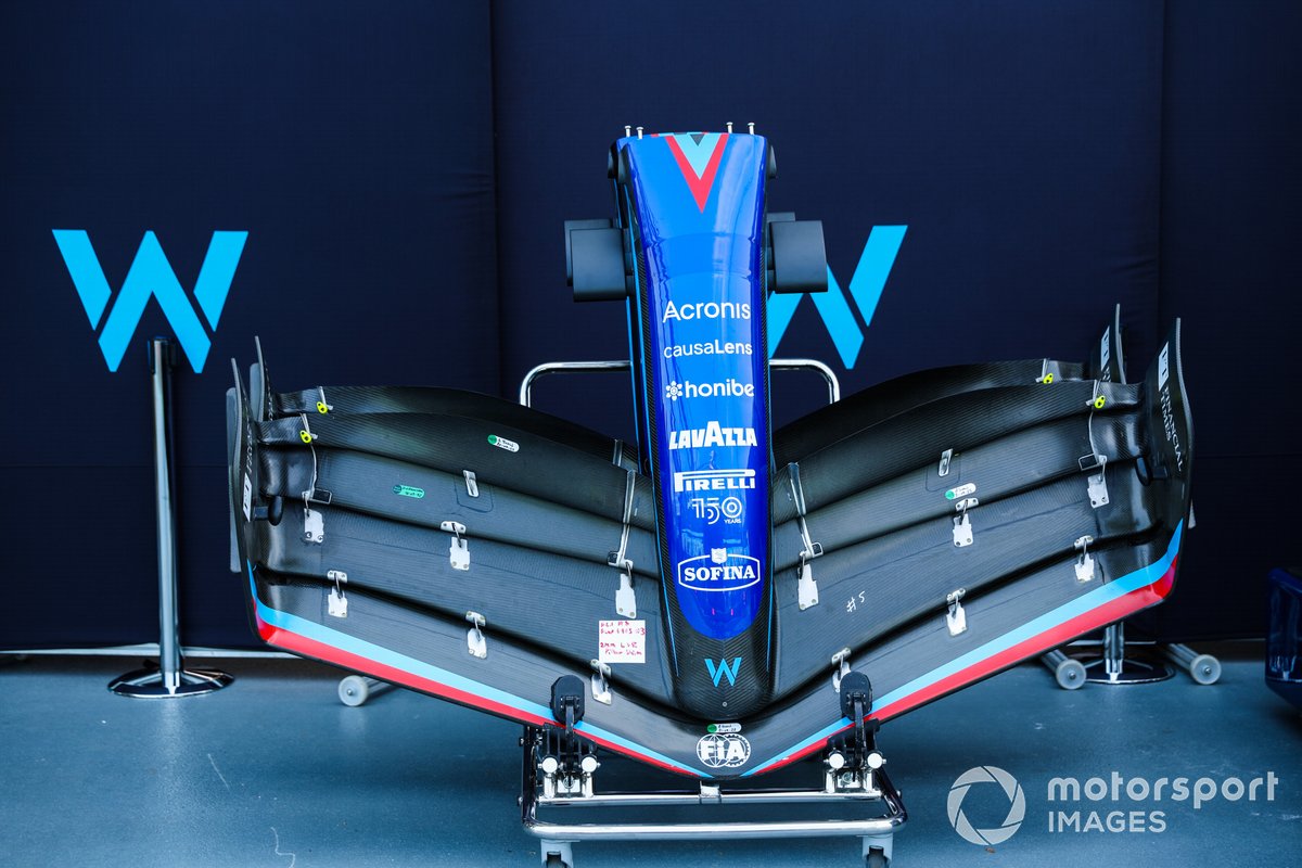 The nose and front wing of a Williams FW44 in the pit lane