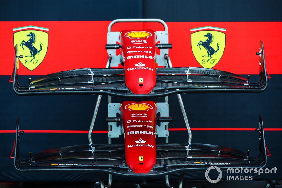 Ferrari F1-75 front wings and nose cones in the pit lane