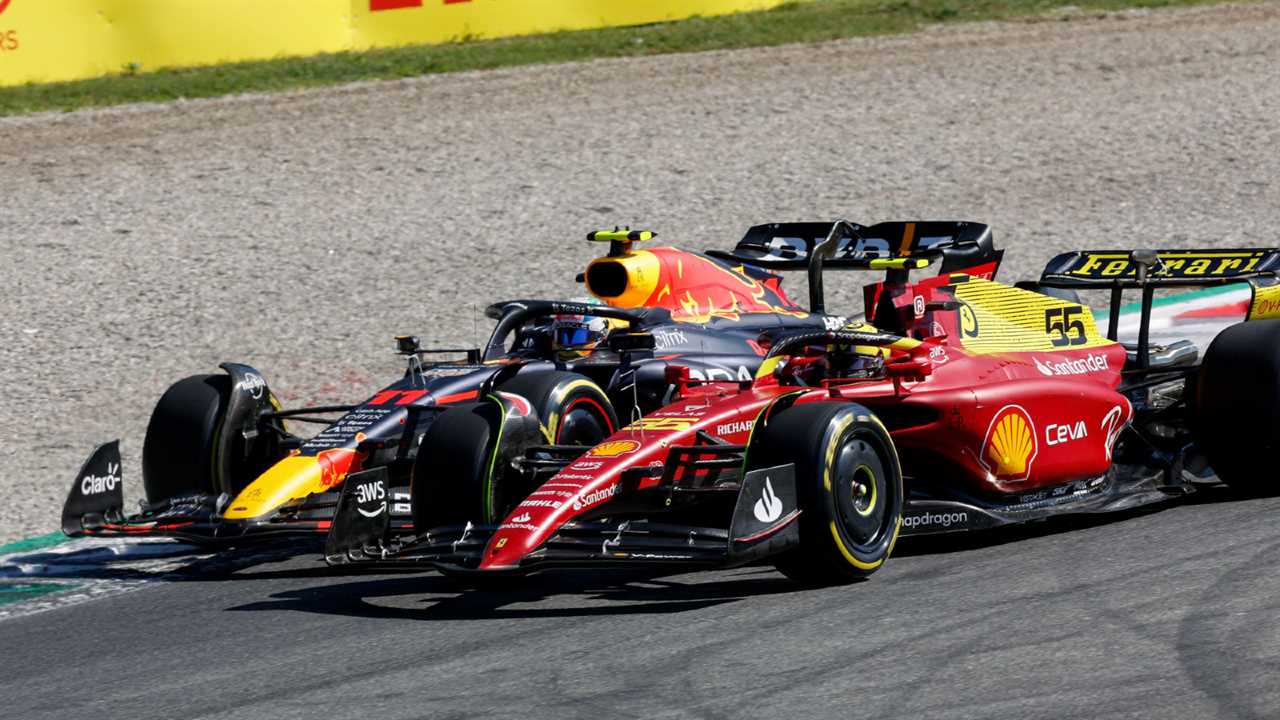 Carlos Sainz, Ferrari and Sergio Perez, Red Bull, race.  Italy, September 2022.