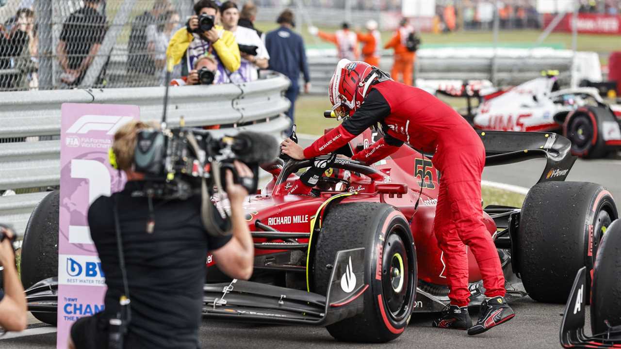 Charles Leclerc leans over congratulating Carlos Sainz on his first F1 win.  SilverstoneJuly 2022