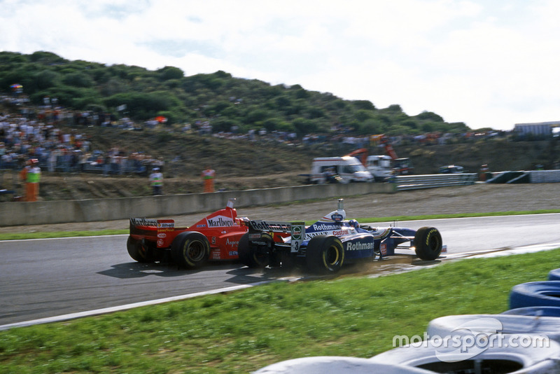 Michael Schumacher (Ferrari F310B), Jacques Villeneuve (Williams FW19 Renault)