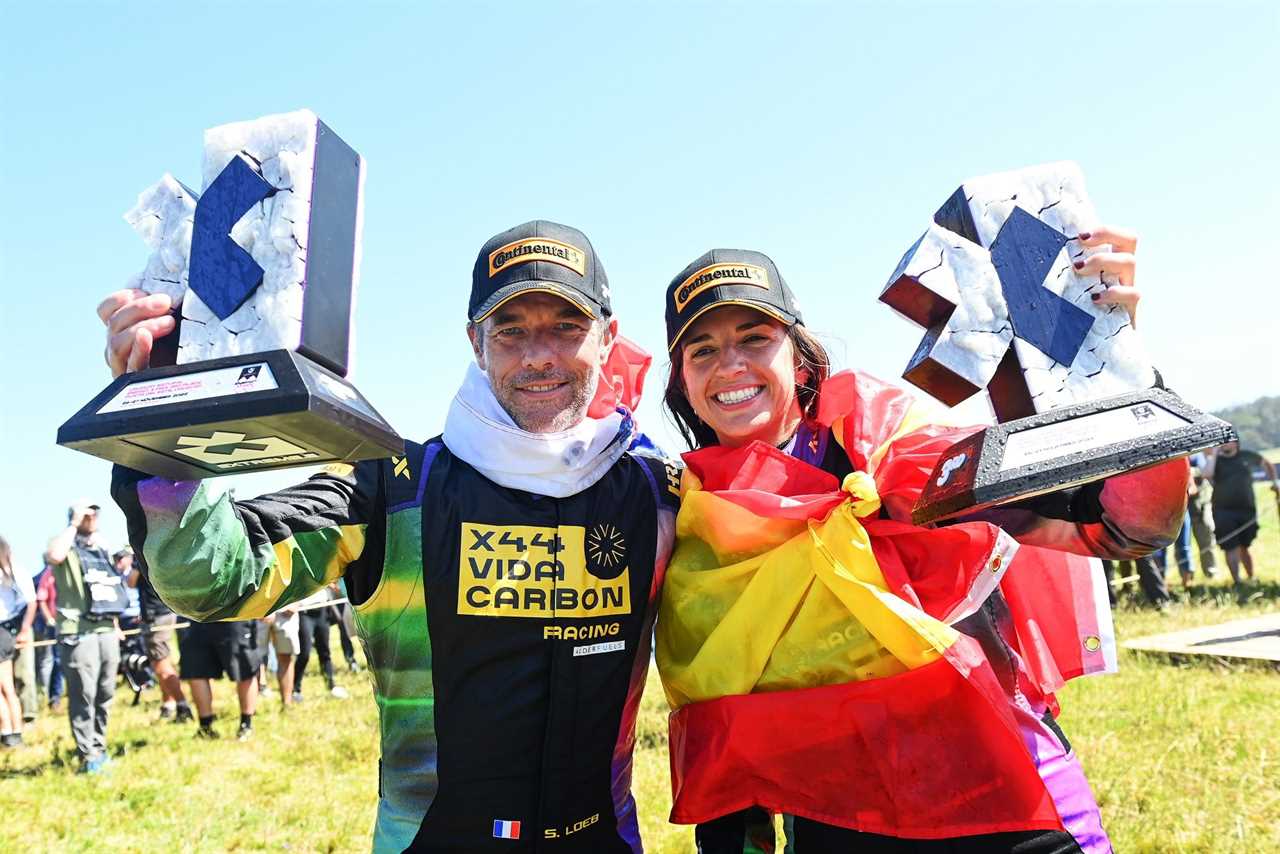november 27 sebastien loeb fra, team x44, and cristina gutierrez esp, team x44, celebrate winning the team championship, as well as finishing 3rd in the race during the punta del este on november 27, 2022 photo by sam bagnall lat images