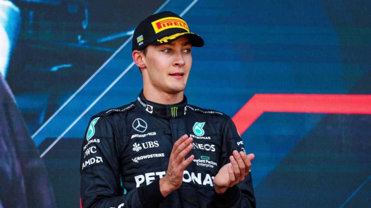 George Russell applauding on the podium. Baku June 2022