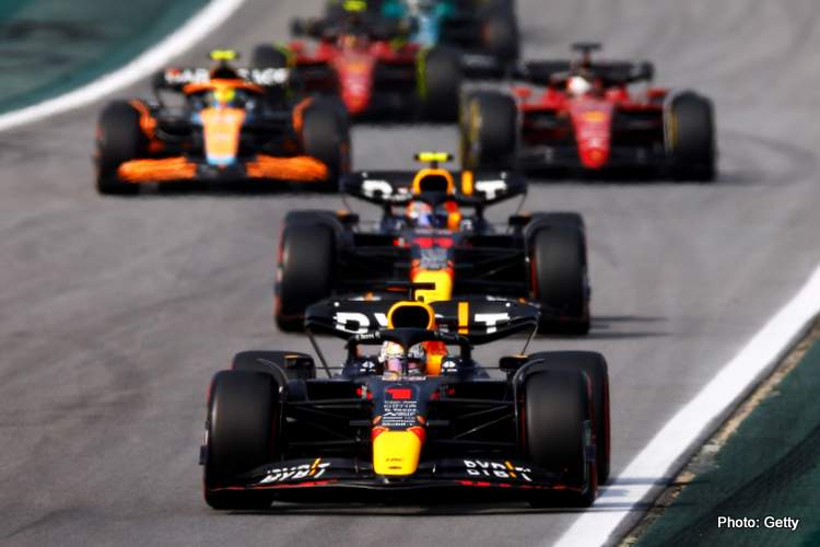 SAO PAULO, BRAZIL - NOVEMBER 13: Max Verstappen of the Netherlands driving the (1) Oracle Red Bull Racing RB18 leads a line of cars during the F1 Grand Prix of Brazil at Autodromo Jose Carlos Pace on November 13, 2022 in Sao Paulo, Brazil .  (Photo by Jared C Tilton/Getty Images)