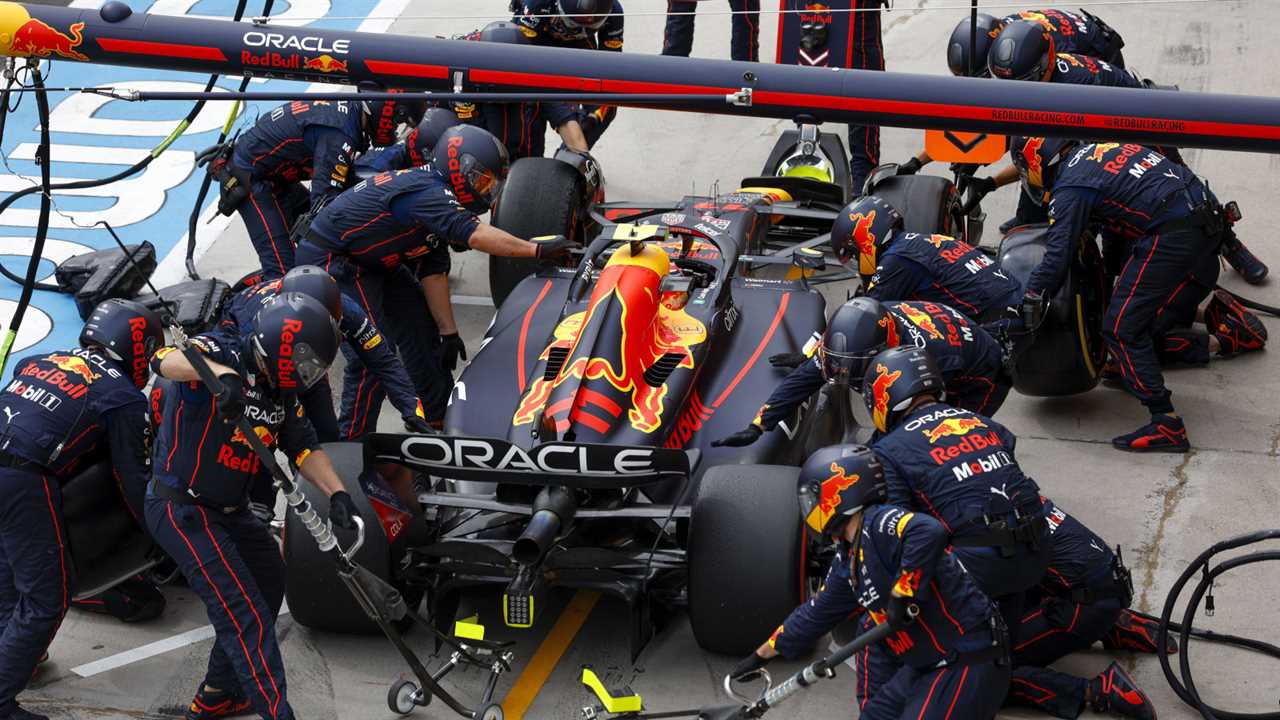 Sergio Perez makes a pit stop, surrounded by Red Bull Racing mechanics. Hungary July 2022